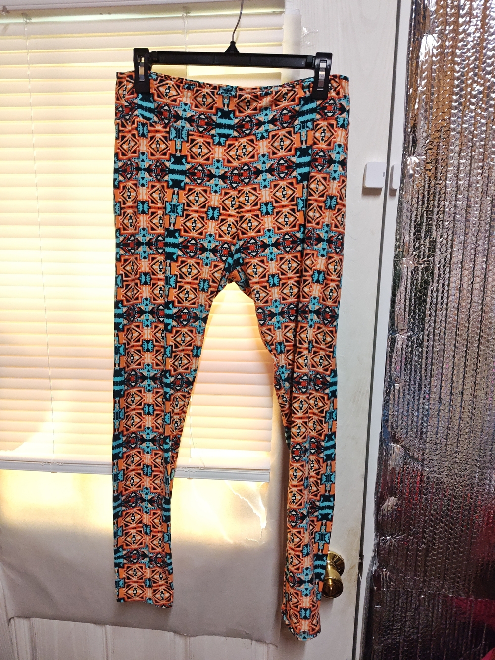 LuLaRoe Orange and Teal Geometric Leggings
